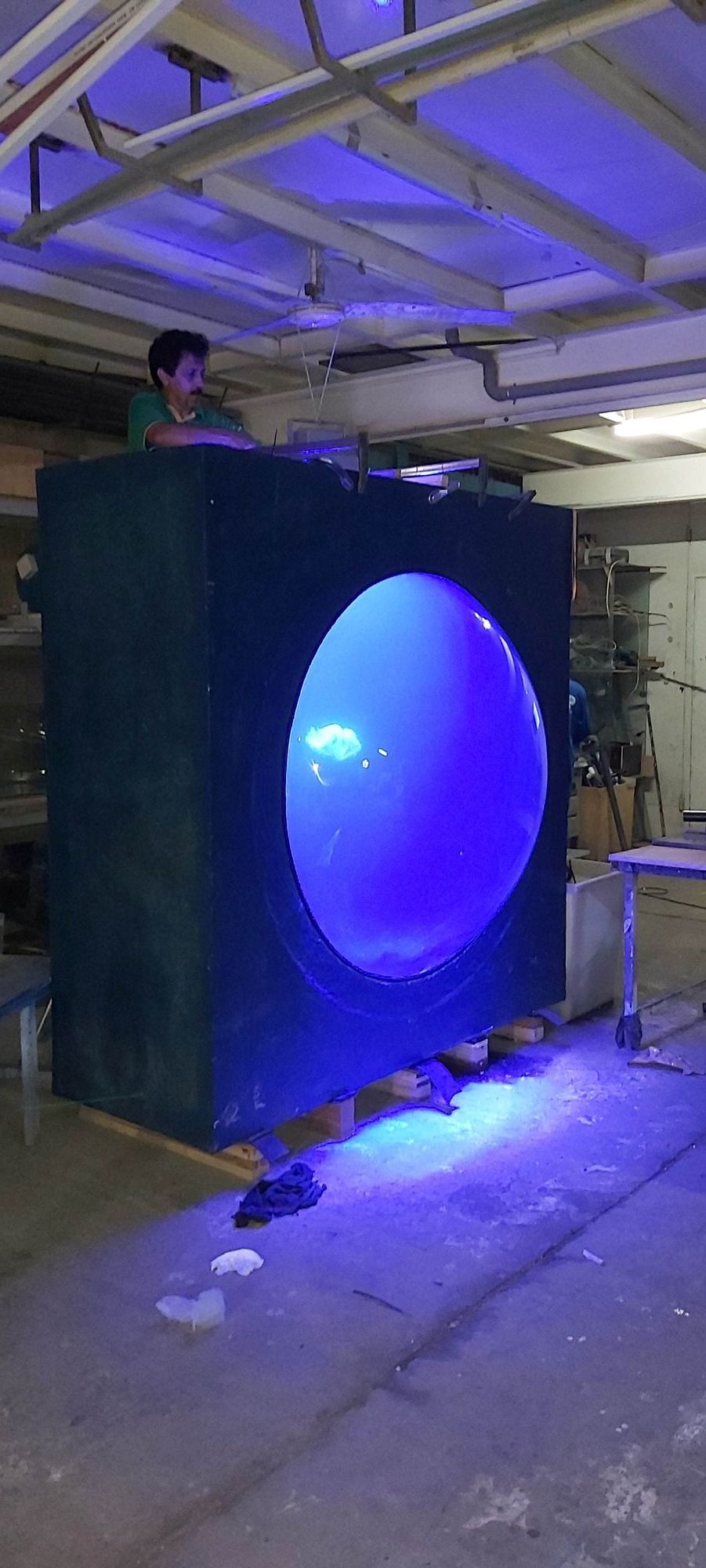 Expo 2020 Jellyfish Tank: A Custom Kreisel Display for the Terra Sustainability Pavilion 3 Jellyfish tank housing with a rounded viewing window being built in the Water Wonders workshop in Dubai