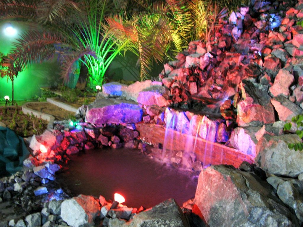 Water Feature Water Saving in the UAE: Practical Guide 2 Night-lit rock waterfall and pond