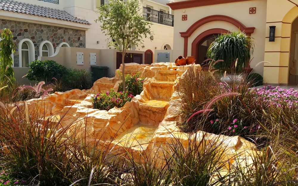 Fake Rock Covers: Hide Pool Pumps & AC Units in Style 1 Artificial sandstone rock fountain in a villa garden