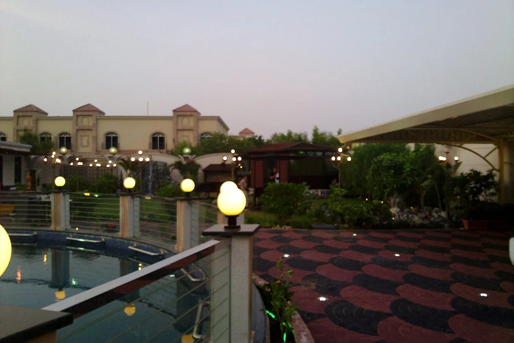 Fountain and Water Feature Maintenance Checklist for the UAE 1 Circular fountain pool in a villa garden at dusk