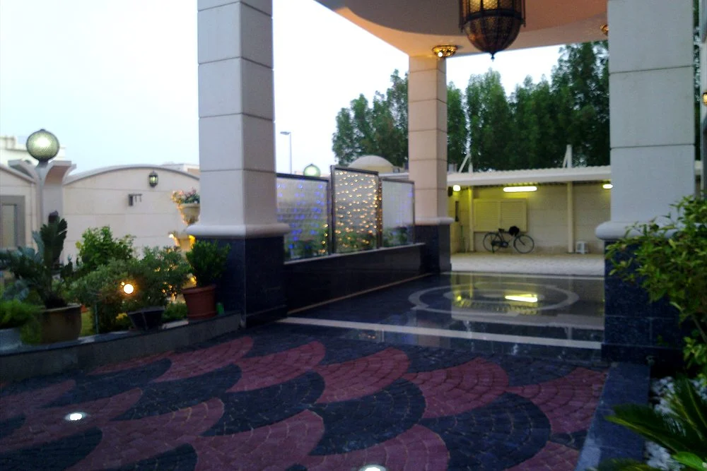 Water Feature Cost in Dubai: Fountains, Waterfalls and Water Walls 1 Entrance courtyard with a patterned stone pavement and pool