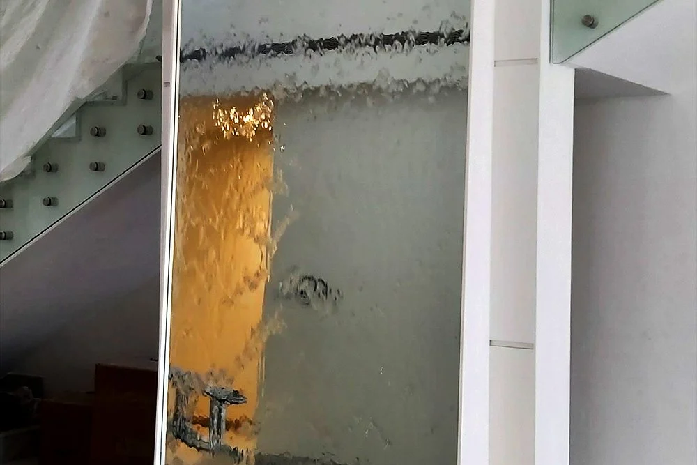 Indoor Water Walls: Ideas for Lobbies, Hotels and Luxury Homes 2 Freestanding glass water panel on a marble base
