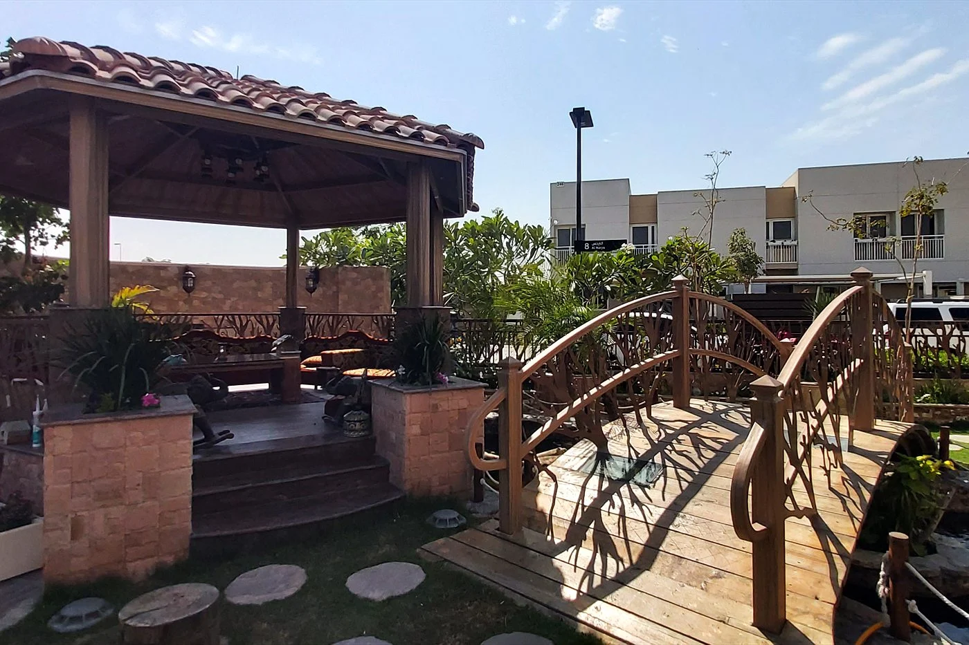 Garden pond with a bridge and gazebo at a UAE villa