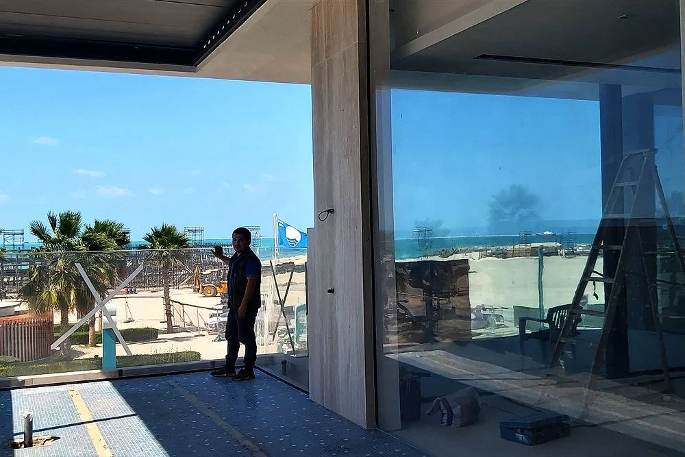How Much Does a Modern Pool Cost in Dubai? (2026 Guide) 2 Glass-fronted pool room with sea views in Dubai
