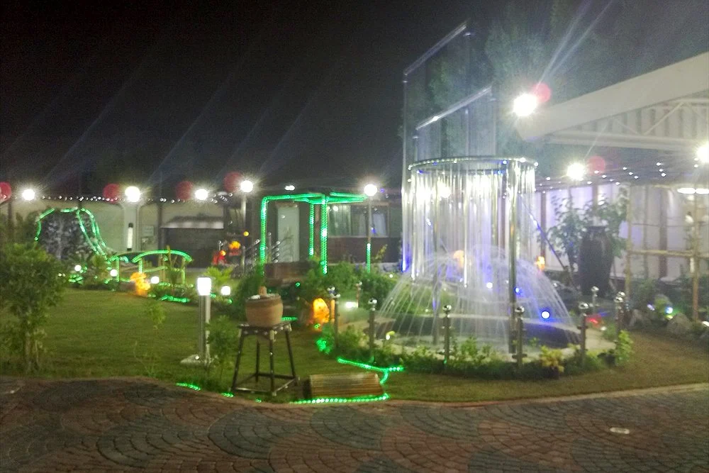 Water Feature Cost in Dubai: Fountains, Waterfalls and Water Walls 2 Lit garden water feature at night in the UAE