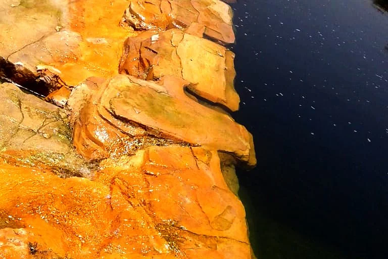 Artificial Rock vs Natural Stone for Waterfalls and Ponds 2 Natural-looking artificial sandstone rock around a water feature
