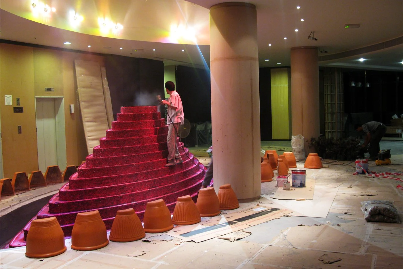 Tiered red fountain installed in a lobby