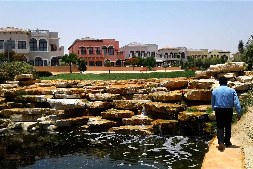 Artificial Rock vs Natural Stone for Waterfalls and Ponds 1 Water cascading over hand-finished artificial rock