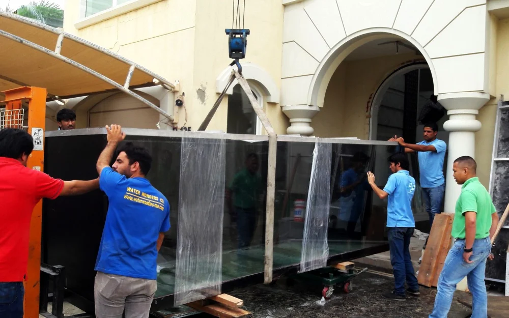 Aquariums & Water Features in Abu Dhabi 1 Water Wonders team installing an acrylic aquarium on site